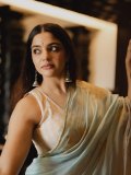 nikhila-vimal-in-lightweight-pastel-aqua-saree-with-sleeveless-V-neck-fitted-blouse-photos-004
