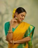nikhila-vimal-in-mango-yellow-saree-with-contrast-blouse-photos-001