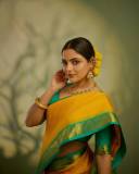 nikhila-vimal-in-mango-yellow-saree-with-contrast-blouse-photos-002