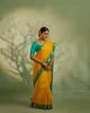 nikhila-vimal-in-mango-yellow-saree-with-contrast-blouse-photos-003