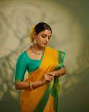 nikhila-vimal-in-mango-yellow-saree-with-contrast-blouse-photos
