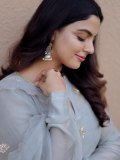 nikhila-vimal-in-pastel-gray-traditional-Indian-Anarkali-set-photos-001