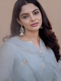 nikhila-vimal-in-pastel-gray-traditional-Indian-Anarkali-set-photos-004