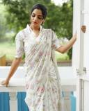 actress-nikhila-vimal-new-photos-in-white-floral-printed-saree-with-blouse
