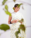 nikhila-vimal-in-white-saree-with-sleeveless-blouse