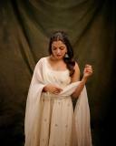 nikhila-vimal-in-white-sleeveless-churidar-with-floral-print-dress-photos-002