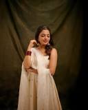 nikhila-vimal-in-white-sleeveless-churidar-with-floral-print-dress-photos-005