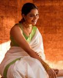 nikhila-vimal-new-pic-in-kerala-saree-with-light-green-border-and-blouse-003