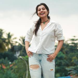 niranjana-anoop-in-white-shirt-and-jeans-photos-001