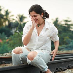 niranjana-anoop-in-white-shirt-and-jeans-photos-002