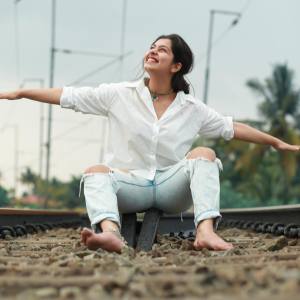 niranjana-anoop-in-white-shirt-and-jeans-photos-003