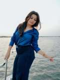 niranjana-anoop-in-vibrant-royal-blue-long-sleeved-button-down-shirt-and-High-waisted-wide-leg-dark-wash-jeans-photos