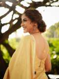 poornima-indrajith-in-saree-with-stylish-hairstyles-photos-003