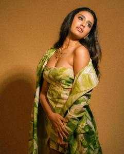 actress-priya-varrier-latest-pics-in-Green-Trench-Jacket-with-Short-Dress-002