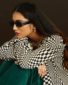 priya-varrier-in-black-shrug-and-glass-photo-002