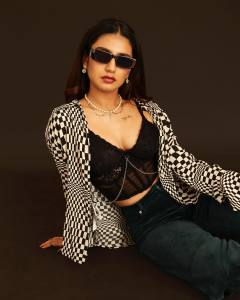 priya-varrier-in-black-shrug-and-glass-photo