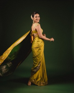 priya-varrier-in-mustard-yellow-hue-with-a-glossy-silk-saree-heavily-embellished-sleeveless-corset-or-bustier-style-blouse-ideas-photos-001