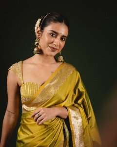 priya-varrier-in-mustard-yellow-hue-with-a-glossy-silk-saree-heavily-embellished-sleeveless-corset-or-bustier-style-blouse-ideas-photos-002