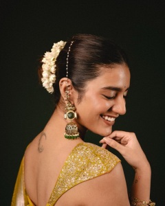 priya-varrier-in-mustard-yellow-hue-with-a-glossy-silk-saree-heavily-embellished-sleeveless-corset-or-bustier-style-blouse-ideas-photos-003