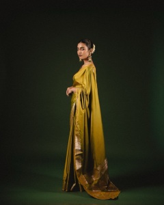 priya-varrier-in-mustard-yellow-hue-with-a-glossy-silk-saree-heavily-embellished-sleeveless-corset-or-bustier-style-blouse-ideas-photos-005