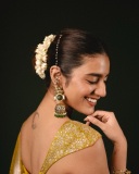 priya-varrier-in-mustard-yellow-hue-with-a-glossy-silk-saree-heavily-embellished-sleeveless-corset-or-bustier-style-blouse-ideas-photos-003