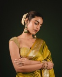 priya-varrier-in-mustard-yellow-hue-with-a-glossy-silk-saree-heavily-embellished-sleeveless-corset-or-bustier-style-blouse-ideas-photos-006
