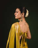 priya-varrier-in-mustard-yellow-hue-with-a-glossy-silk-saree-heavily-embellished-sleeveless-corset-or-bustier-style-blouse-ideas-photos-010
