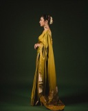 priya-varrier-in-mustard-yellow-hue-with-a-glossy-silk-saree-heavily-embellished-sleeveless-corset-or-bustier-style-blouse-ideas-photos-012