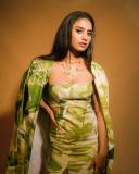 actress-priya-varrier-latest-pics-in-Green-Trench-Jacket-with-Short-Dress-001
