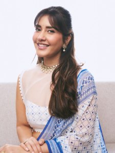 raashi-khanna-in-lightweight-sheer-white-fabric-saree-with-matching-sleeveless-blouse-with-a-sheer-mesh-illusion-neckline-photos-004