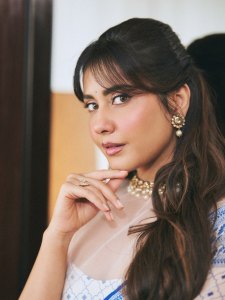raashi-khanna-in-lightweight-sheer-white-fabric-saree-with-matching-sleeveless-blouse-with-a-sheer-mesh-illusion-neckline-photos-005