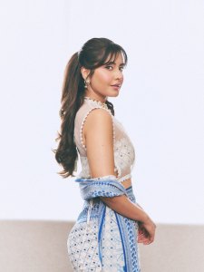 raashi-khanna-in-lightweight-sheer-white-fabric-saree-with-matching-sleeveless-blouse-with-a-sheer-mesh-illusion-neckline-photos