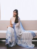 raashi-khanna-in-lightweight-sheer-white-fabric-saree-with-matching-sleeveless-blouse-with-a-sheer-mesh-illusion-neckline-photos-001