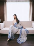 raashi-khanna-in-lightweight-sheer-white-fabric-saree-with-matching-sleeveless-blouse-with-a-sheer-mesh-illusion-neckline-photos-009