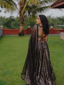 Actress-Rajisha-Vijayan-A-fitted-sleeveless-V-neck-crop-top-and-dark-Lehenga-photos-001