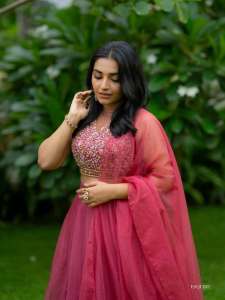 rajisha-vijayan-in-classic-three-piece-magenta-lehenga-set-sleeveless-cropped-blouse-with-intricate-floral-embroidery-photos-003