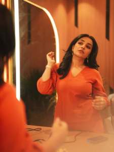 rajisha-vijayan-in-orange-colour-jugalbandi-outfit-photos-008