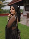 Actress-Rajisha-Vijayan-A-fitted-sleeveless-V-neck-crop-top-and-dark-Lehenga-photos-002