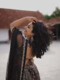 Actress-Rajisha-Vijayan-A-fitted-sleeveless-V-neck-crop-top-and-dark-Lehenga-photos-004