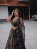 Actress-Rajisha-Vijayan-A-fitted-sleeveless-V-neck-crop-top-and-dark-Lehenga-photos-008