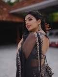Actress-Rajisha-Vijayan-A-fitted-sleeveless-V-neck-crop-top-and-dark-Lehenga-photos-009