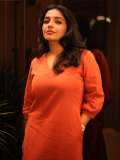 rajisha-vijayan-in-orange-colour-jugalbandi-outfit-photos-006