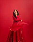 rajisha-vijayan-in-vibrant-red-full-sleeve-flared-Anarkali-styling-with-Traditional-gold-jhumkas-and-statement-rings-photos-002