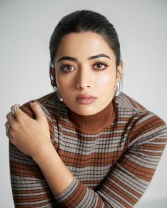 rashmika-mandanna-in-Striped-Straight-Skirt-and-top-dress-with-Knee-High-Opaque-Stockings-photos-005
