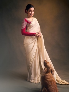 rashmika-mandanna-in-cream-colored-saree-with-pink-long-sleeved-blouse-adorned-with-rich-intricate-gold-paisley-and-floral-embroidery-design-photos-001