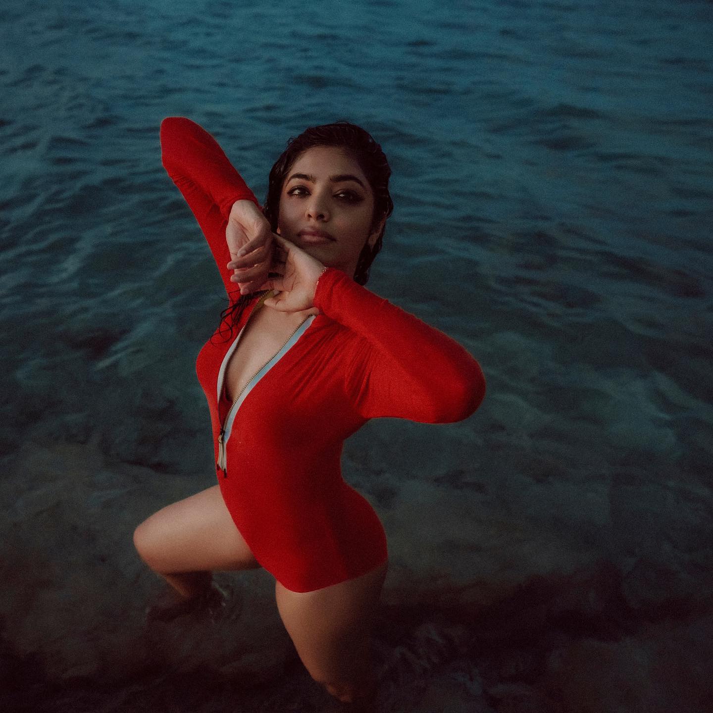 1_actress-rima-kallingal-new-images-in-red-Zipper-Body-Suit-001