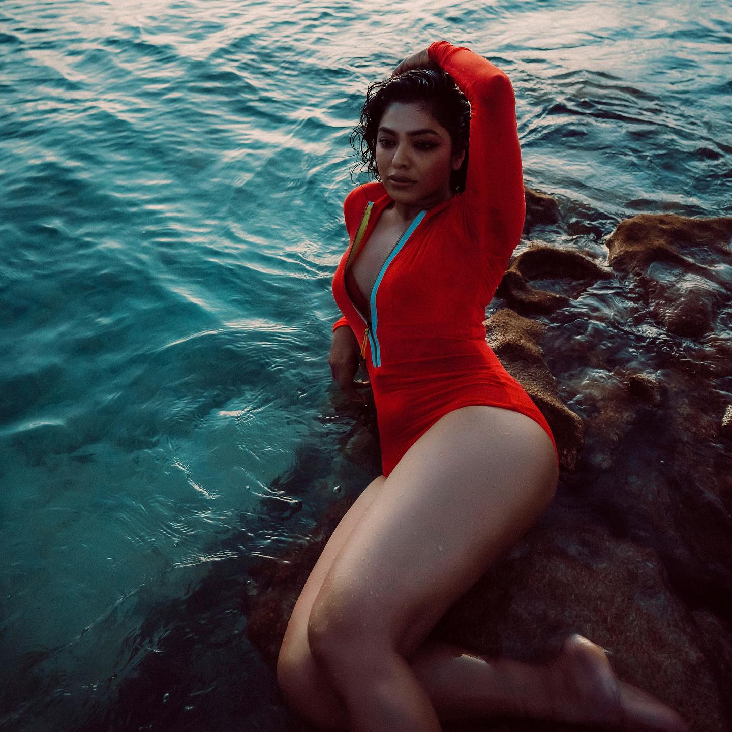 actress-rima-kallingal-new-images-in-red-Zipper-Body-Suit-002