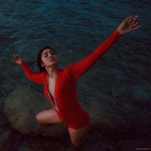 actress-rima-kallingal-new-images-in-red-Zipper-Body-Suit-003