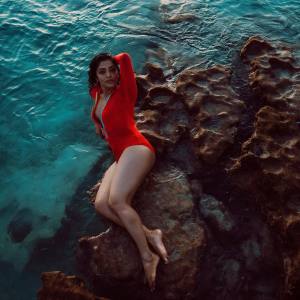actress-rima-kallingal-new-images-in-red-Zipper-Body-Suit