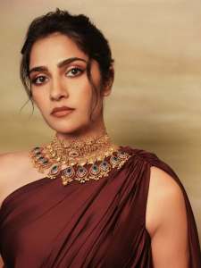 rukmini-vasanth-in-Deep-Wine-Draped-Indo-Western-Gown-Styled-with-a-chunky-traditional-gold-choker-set-with-blue-accents-photos-002